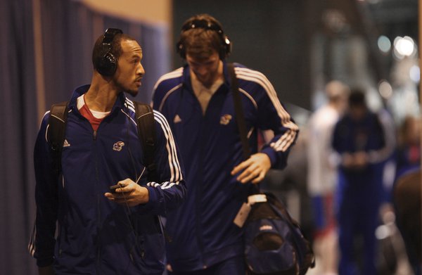 Kansas guard Travis Releford and center Jeff Withey make their way into the arena for interviews and practice on Saturday, March 17, 2012 at CenturyLink Center in Omaha.