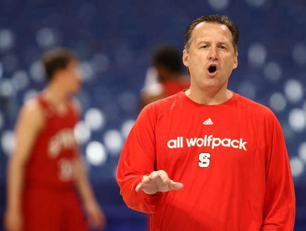 North Carolina State head coach Mark Gottfried directs his players during practice at the Edward Jones Dome in St. Louis.