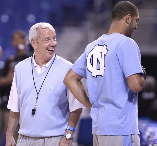 North Carolina head coach Roy Williams laughs with injured guard Kendall Marshall during a day of press conferences and practices at the Edward Jones Dome in St. Louis.