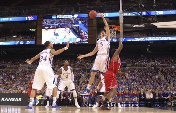 Kansas center Jeff Withey blocks a shot by North Carolina State forward Richard Howell during the second half on Friday, March 23, 2012 at the Edward Jones Dome in St. Louis.