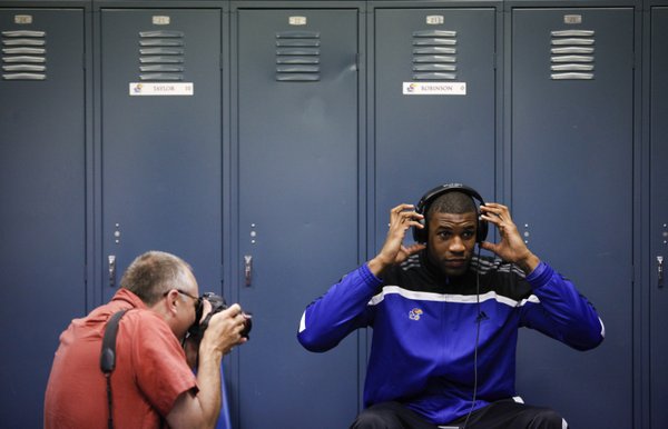 Kansas forward Thomas Robinson settles into his headphones as he is photographed in the team locker room after an afternoon of interviews on Saturday, March 24, 2012 at the Edward Jones Dome in St. Louis.