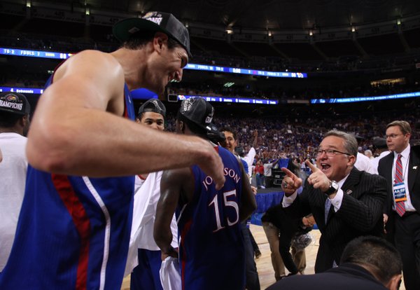 Kansas center Jeff Withey celebrates with director of basketball operations Barry Hinson after the Jayhawks' 80-67 win over North Carolina to advance to the Final Four on Sunday,  March 25, 2012 at the Edward Jones Dome in St. Louis.