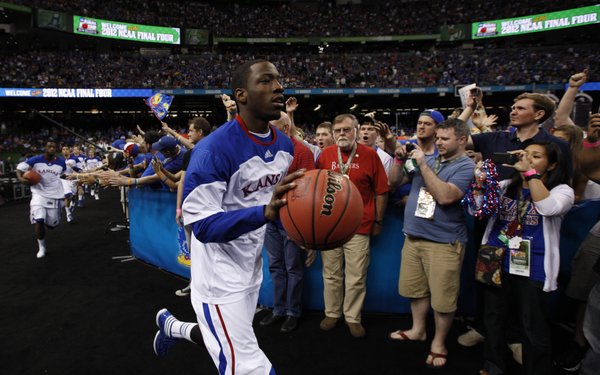 Kansas guard Tyshawn Taylor leads the Jayhawks to the court prior to tipoff against Ohio State at the Superdome on Saturday, March 31, 2012.