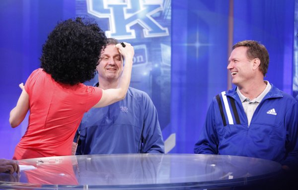 Kansas head coach Bill Self smiles at Kentucky head coach John Calipari as the two sit for makeup before their joint CBS interview on Sunday, April 1, 2012 at the Superdome.