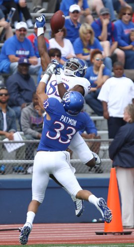 Kansas cornerback Tyler Patmon breaks up a pass to receiver Chris Omigie during the first half of the Spring Game on Saturday, April 28, 2012 at Kivisto Field.