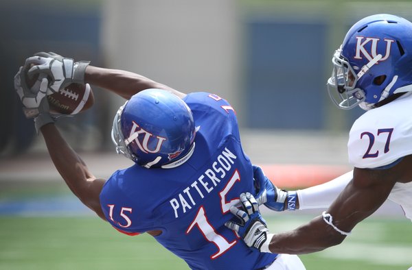 Kansas receiver Daymond Patterson is pushed out of bounds for an incomplete pass by safety Victor Simmons during the first half of the Spring Game on Saturday, April 28, 2012 at Kivisto Field.