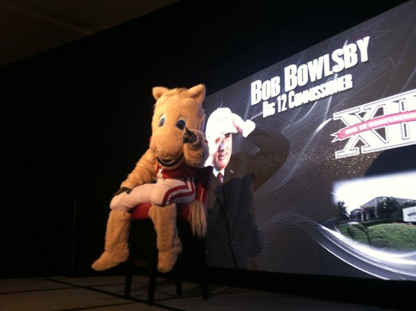 "Boomer" the Oklahoma mascot sits in the place of Big 12 commissioner Bob Bowlsby before the start of Big 12 football media days on Monday, July 23, 2012, in Dallas.
