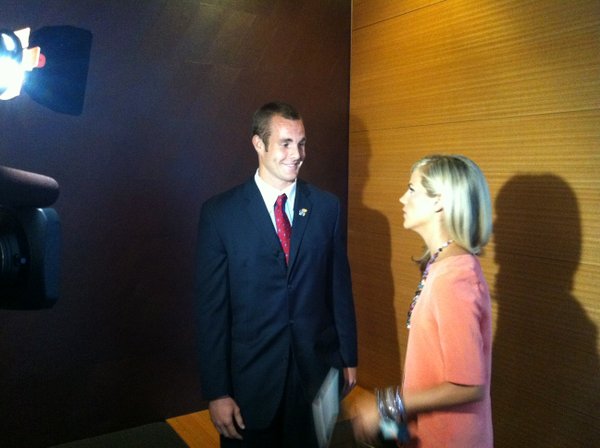 Kansas quarterback Dayne Crist talks with ESPN's Samantha Steele before an interview on Tuesday at Big 12 media days in Dallas.