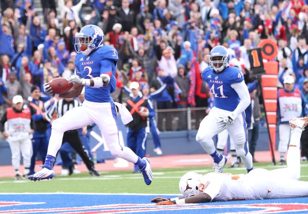 Kansas receiver Tony Pierson leaps into the endzone as he leaves Texas linebacker Steve Edmond on the turf during the second quarter on Saturday, Oct. 27, 2012 at Memorial Stadium.