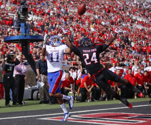 Kansas receiver Tre' Parmalee has a would-be touchdown pass knocked away by Texas Tech defensive back Bruce Jones during the second quarter on Saturday, Nov. 10, 2012 at Jones AT&T Stadium in Lubbock, Texas.