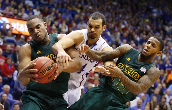 Kansas forward Perry Ellis wrestles for a rebound with Baylor players Rico Gathers, left, and Pierre Jackson during the second half on Monday, Jan. 14, 2013 at Allen Fieldhouse.
