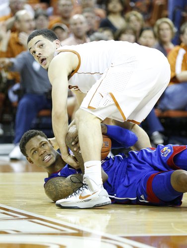Kansas guard Ben McLemore and Texas guard Javan Felix look for a possession call from a game official during the second half on Saturday, Jan. 19, 2013 at Frank Erwin Center in Austin, Texas.