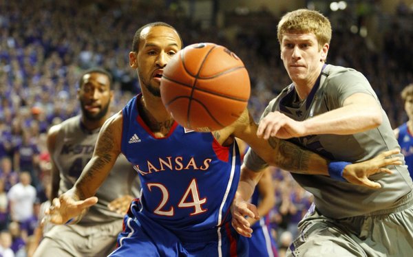 Kansas guard Travis Releford competes for a loose ball with Kansas State guard Will Spradling during the first half on Tuesday, Jan. 22, 2013 at Bramlage Coliseum.