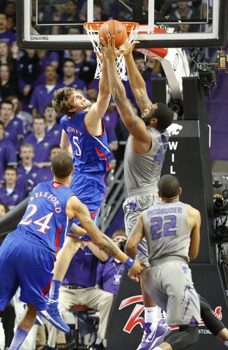 Kansas center Jeff Withey competes for a rebound with Kansas State forward Thomas Gipson during the first half on Tuesday, Jan. 22, 2013 at Bramlage Coliseum.