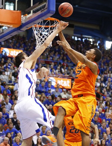 Kansas center Jeff Withey blocks a shot from Oklahoma State forward Le'Bryan Nash during the second half on Saturday, Feb. 2, 2013 at Allen Fieldhouse.