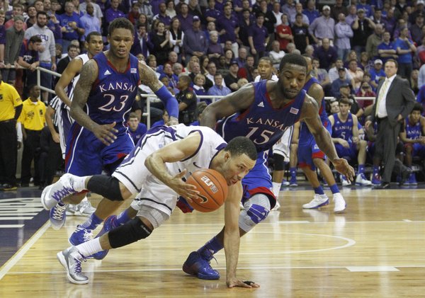 Ben McLemore (23) and Elijah Johnson (15) press TCUs Kyan Anderson (5) late in the Jayhawks 62-55 loss to Texas Christian University, Wednesday at TCU in Ft. Worth, TX.