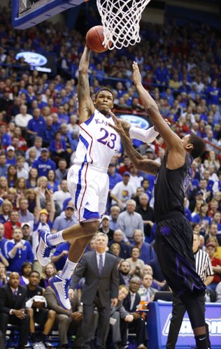 Kansas guard Ben McLemore elevates to the bucket before an intentional foul from Kansas State forward Jordan Henriquez during the first half on Monday, Feb. 11, 2013.
