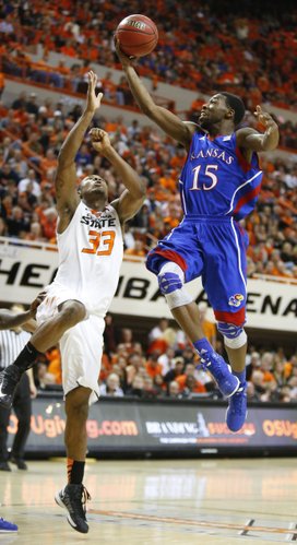 Kansas guard Elijah Johnson puts up a floater over Oklahoma State guard Marcus Smart during the second half on Wednesday, Feb. 20, 2013 at Gallagher-Iba Arena in Stillwater, Oklahoma.