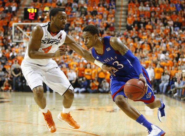 Kansas guard Ben McLemore drives against Oklahoma State guard Brian Williams during the first overtime on Wednesday, Feb. 20, 2013 at Gallagher-Iba Arena in Stillwater, Oklahoma.