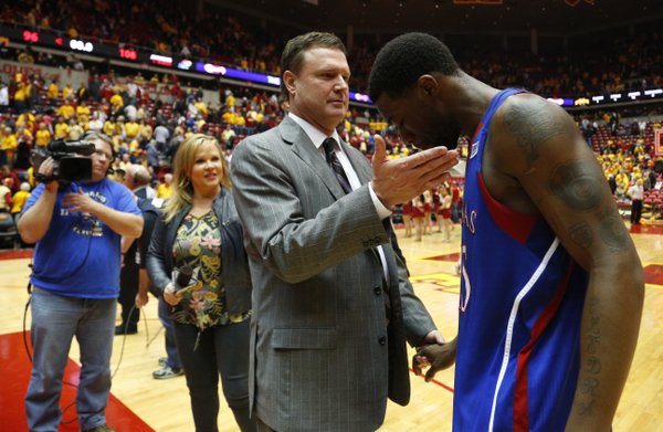 Kansas head coach Bill Self gives a congratulatory pat to Elijah Johnson after the Jayhawks' 108-96 overtime win over Iowa State on Monday, Feb. 25, 2013 at Hilton Coliseum in Ames, Iowa.