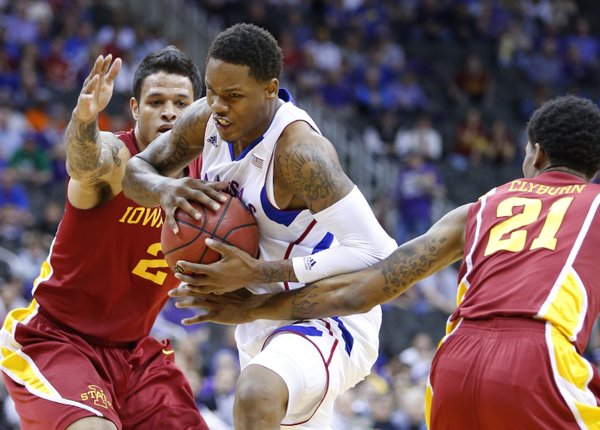 Kansas guard Ben McLemore drives between Iowa State defenders Chris Babb, left, and Willy Clyburn during the first half of the semifinal round of the Big 12 tournament on Friday, March 15, 2013 at the Sprint Center in Kansas City, Missouri.