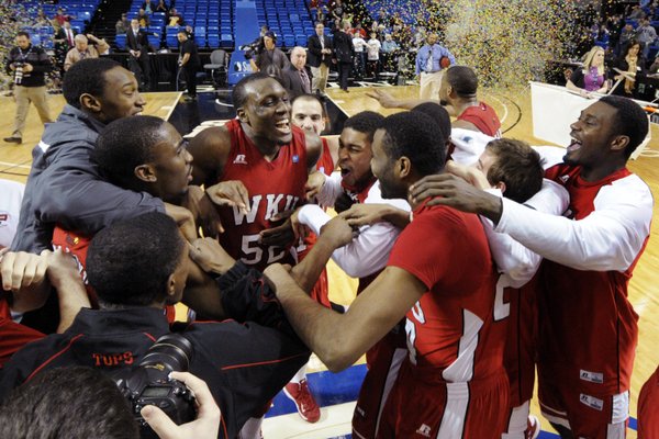 Western Kentucky's T.J. Price (52) celebrates with teammates after the Sun Belt Conference championship game against Florida International on Monday, March 11, 2013, in Hot Springs, Ark., Monday, March 11, 2013. Western Kentucky won 65-63. Price was named the tournament's most valuable player. WKU will face Kansas University in the first round of the NCAA Tournament on Friday, March 22, 2013, in Kansas City, Mo.