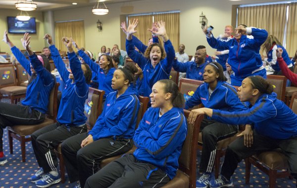 Members of the Kansas women's basketball team celebrate as they learn their fate in the 2013 NCAA Women's Tournament Monday evening at Allen Fieldhouse. The Jayhawks earned the 12th seed in the Norfolk region and will play fifth seeded Colorado at 5:30 p.m. on Saturday.