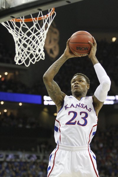 Ben McLemore (23) jumps for a slam dunk in the Jayhawks second-round game against Western Kentucky Friday, March 22, 2013 at the Sprint Center in Kansas City, Mo.