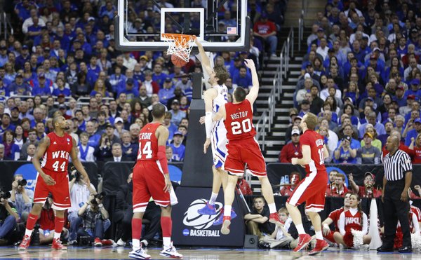 Kansas center Jeff Withey delivers a dunk against Western Kentucky during the first half on Friday, March 22, 2013 at the Sprint Center in Kansas City, Mo.