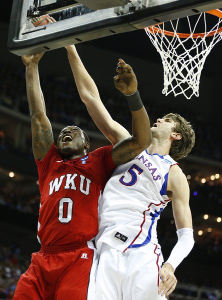 Kansas center Jeff Withey blocks a shot by Western Kentucky forward Kene Anyigbo during the first half on Friday, March 22, 2013 at the Sprint Center in Kansas City, Mo.