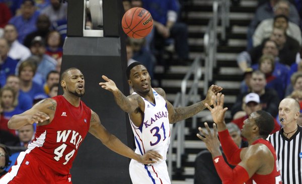 Kansas forward Jamari Traylor loses a pass between Western Kentucky defenders George Fant (44) and T.J. Price during the first half on Friday, March 22, 2013 at the Sprint Center in Kansas City, Mo.