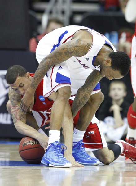 Kansas guard Naadir Tharpe loses the ball between his legs to Western Kentucky guard Brandon Harris during the first half on Friday, March 22, 2013 at the Sprint Center in Kansas City, Mo.