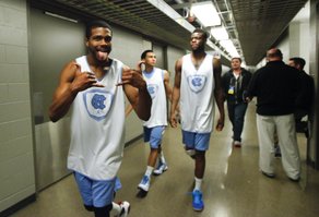 North Carolina guard Dexter Strickland hams it up for the cameras outside the team locker room, Saturday, March 23, 2013 at the Sprint Center in Kansas City, Mo.