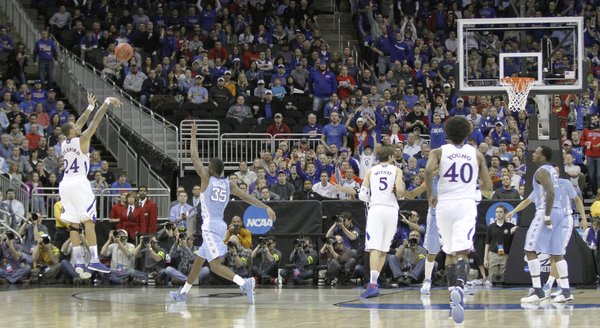 Kansas guard Travis Releford (24) shoots in a second-half three that help propel the Jayhawks to a 70-58 win against North Carolina Sunday, March 24, 2013 at the Sprint Center in Kansas City, Mo..