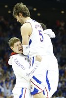 Kansas center Jeff Withey is hoisted up by teammate Tyler Self during a timeout in the second half, Sunday, March 24, 2013 at the Sprint Center in Kansas City, Mo.