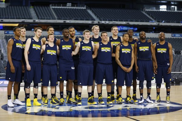 The Michigan players pose for a team photograph during a day of practices and press conference for teams in the South Regional at Cowboys Stadium in Arlington, Texas on Thursday, March 28, 2013.