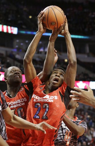 McDonald's East All-American's Andrew Wiggins (22) and Julius Randle (30) battle for a rebound during the second half of the McDonald's All-American Boys basketball game in Chicago on April 3, 2013.