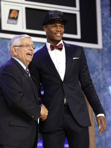NBA Commissioner David Stern, left, shakes hands with Kansas' Ben McLemore, who was selected by the Sacramento Kings in the first round of the NBA basketball draft, Thursday, June 27, 2013, in New York.
