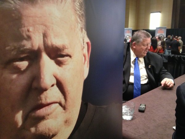 Charlie Weis talks to reporters on Monday afternoon at media days.