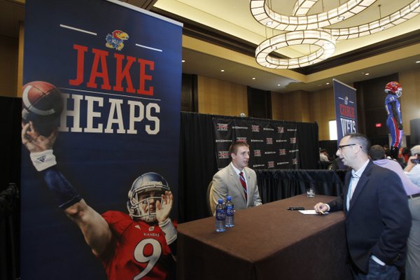 Kanas quarterback Jake Heaps conducts interviews during a breakout session at the Big 12 conference football media days on Monday, July 22, 2013 in Dallas.