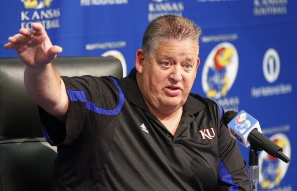 Kansas head football coach Charlie Weis goes over his depth chart and other changes to his team with an audience of media members on Wednesday, Aug. 7, 2013.
