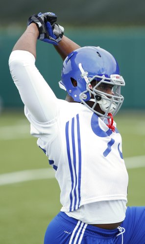 Kansas University defensive lineman Andrew Bolton stretches during practice on Friday, Aug. 9, 2013, at the Jayhawks’ fall camp. Bolton, a juco newcomer, has star potential once he knocks off some rust, according to his coach on the KU defensive line, Buddy Wyatt.