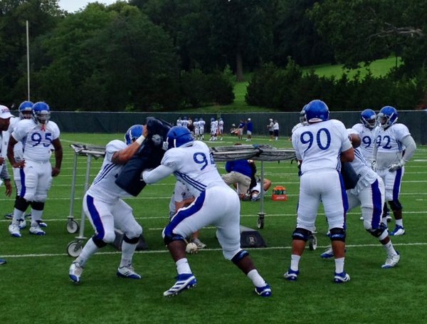 KU's defensive linemen work a leverage drill during Thursday morning's practice. 