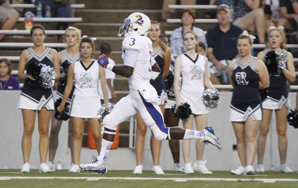Kansas running back Tony Pierson darts up the sideline for a touchdown past the Rice cheerleaders during the second quarter on Saturday, Sept. 14, 2013 at Rice Stadium in Houston, Texas.