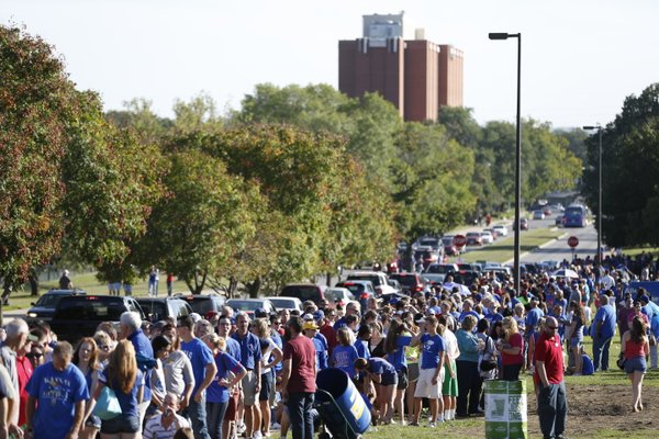 Scores of fans line up down Naismith Drive before the fieldhouse doors opened for Late Night in the Phog, Friday, Oct. 4, 2013.