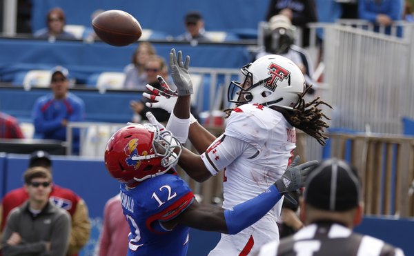 Kansas cornerback Dexter McDonald gets called for interference on an endzone pass to Texas Tech receiver Bradley Marquez during the second quarter on Saturday, Oct. 5, 2013 at Memorial Stadium.