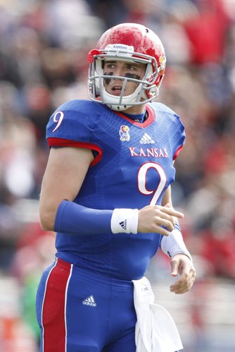 Kansas quarterback Jake Heaps looks at the scoreboard after coming off the field against Texas Tech during the third quarter on Saturday, Oct. 5, 2013 at Memorial Stadium.