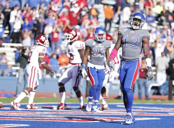 Kansas cornerback Dexter McDonald turns back to the bench after giving up a touchdown to Oklahoma receiver Jaz Reynolds during the second quarter on Saturday, Oct. 19, 2013 at Memorial Stadium.