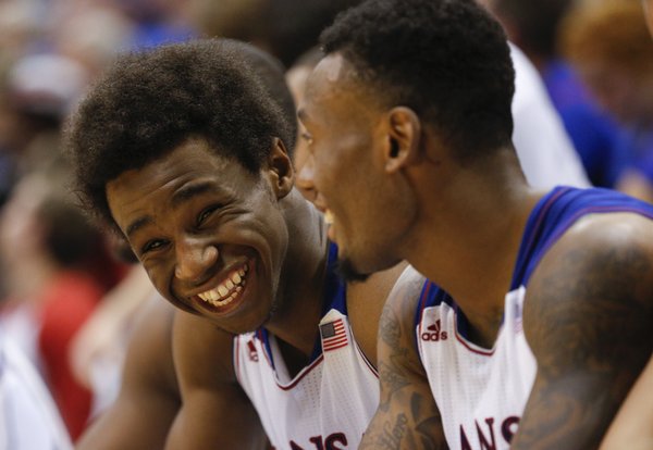 Kansas guards Andrew Wiggins, left, and Naadir Tharpe laugh on the bench during the second half of an exhibition game on Tuesday, Oct. 29, 2013 at Allen Fieldhouse.