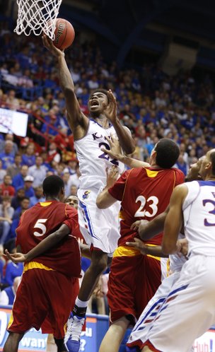 Kansas guard Andrew Wiggins slashes to the bucket between Pittsburg State players Devon Branch (5) and Alex Williams (23) during the second half of an exhibition game on Tuesday, Oct. 29, 2013 at Allen Fieldhouse.